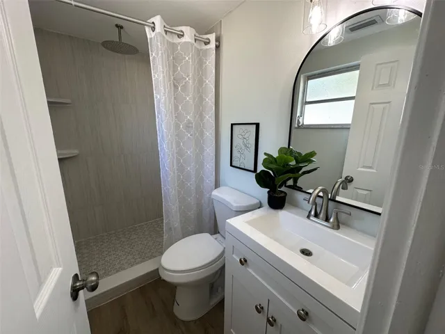 Master Bathroom with both regular shower head and separate rain head.