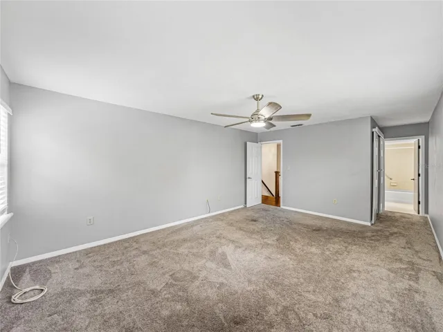Primary Bedroom with walk in closet and tub/shower