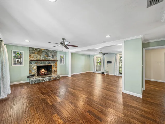 Family room with wood burning stone fireplace