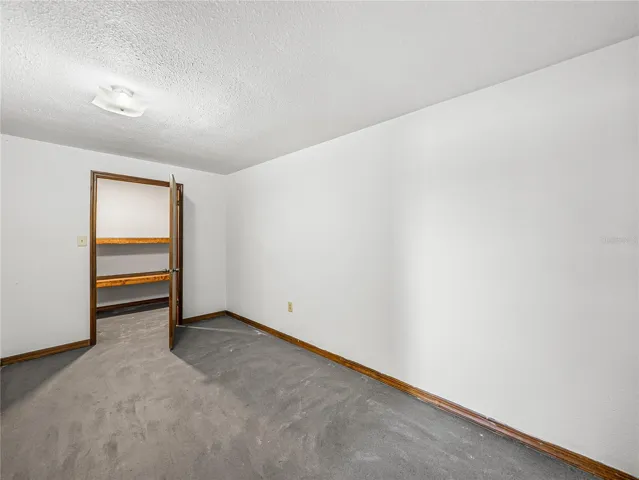 Basement level office/bedroom with closet