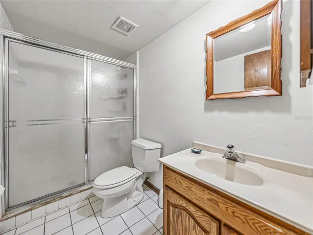 Full bath with shower at basement level