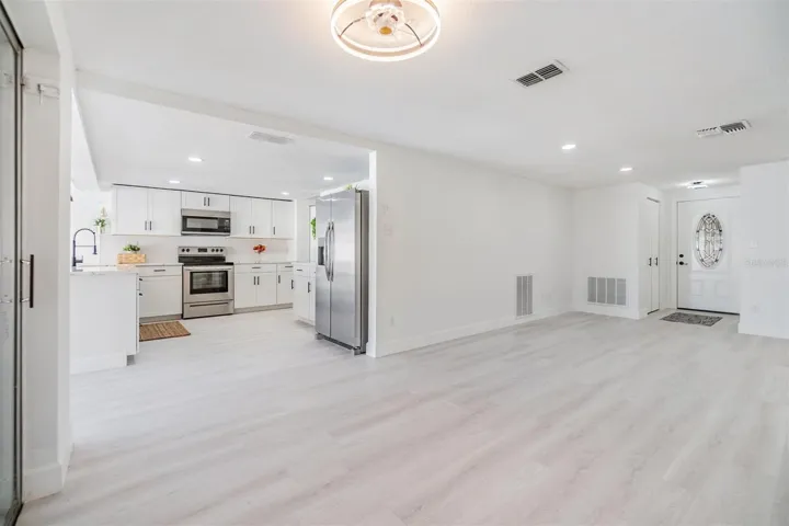 Dining room, view into kitchen and living room by front door
