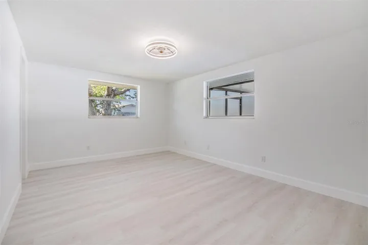 Primary Bedroom with walk in closet and entrance into bathroom.