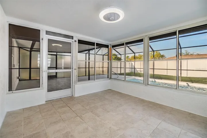 Flex room next to patio / pool area.
