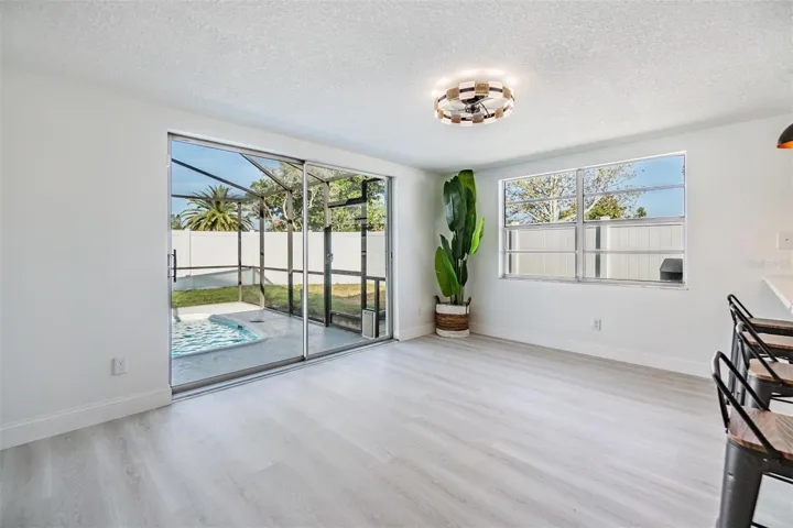 A great area for a family room or dining room.  2 sliders in this room.