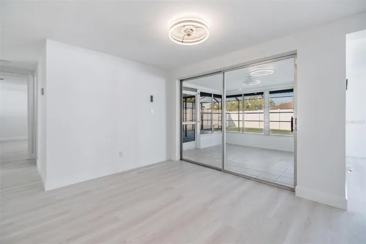 Dining Room with entrance into a flex room which enters into the patio/pool area.