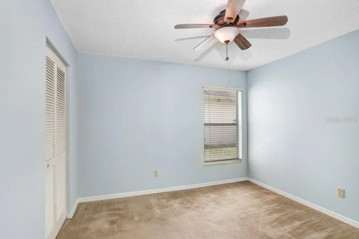 The 3rd bedroom features a lighted ceiling fan and a good-sized closet.