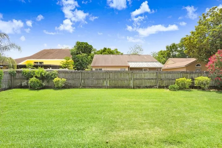 Oh my goodness, this backyard is huge, completely fenced, and well-maintained!  Perfect for a pool or even just for the kids or fur babies to run and play!
