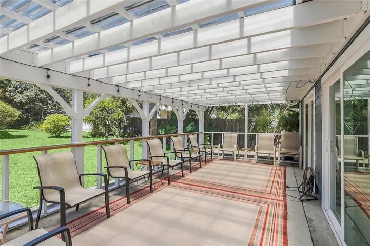 SCREEN ENCLOSED PATIO ATTACHED TO 'GARAGE'