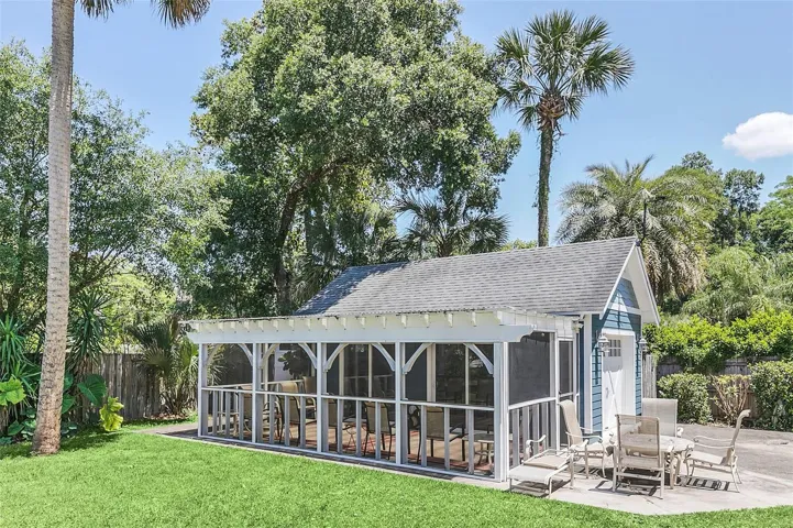 REAR EXTERIOR - SCREEN ENCLOSED PATIO - GARAGE