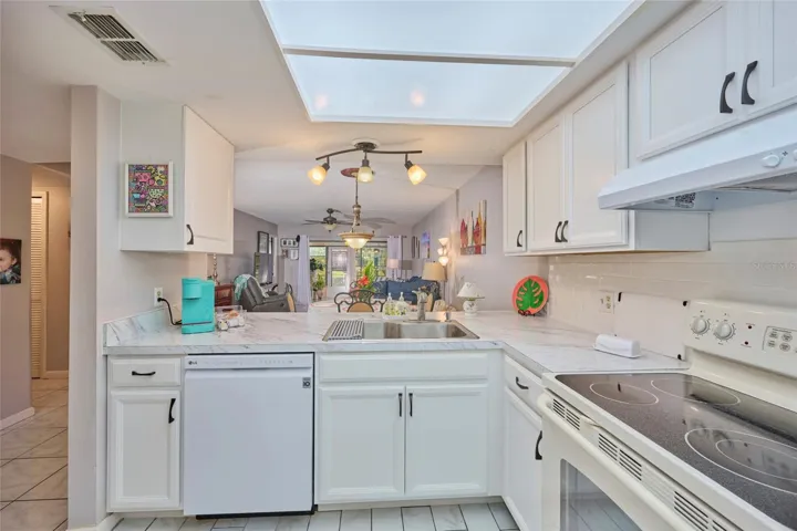 Kitchen has new cabinets.  Nice view out through the sliders!