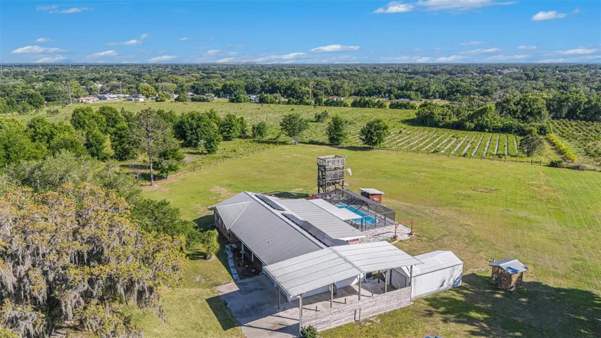 A cleared lot! PAID solars. Shed. Covered RV space.