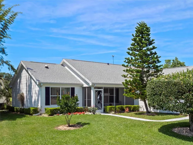 Front view with landscaped front yard