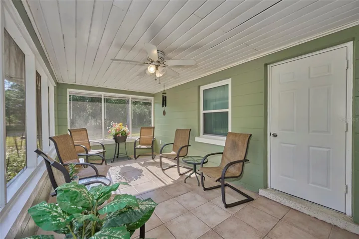 Love the painted wood ceiling in the sun room!