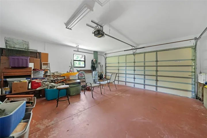 Two car garage has a screen for garage door