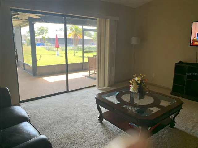 Living room with sliders to large lanai