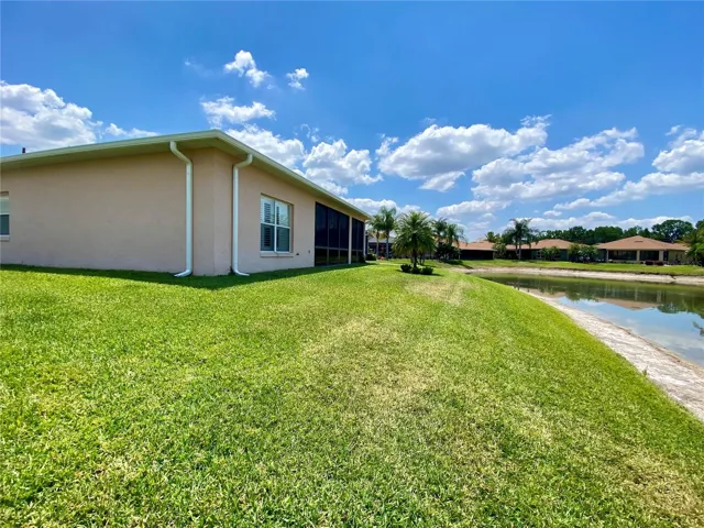 Large lot with side yard and overlooking pond