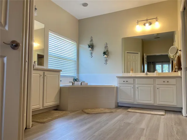 Soaking tub with double vanities in master bath