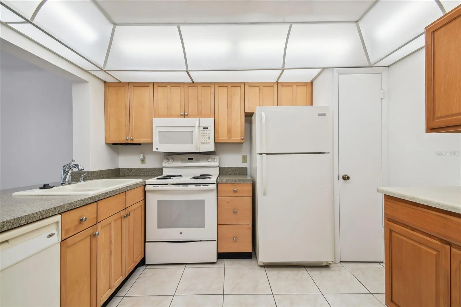 Pantry to the right of the refrigerator
