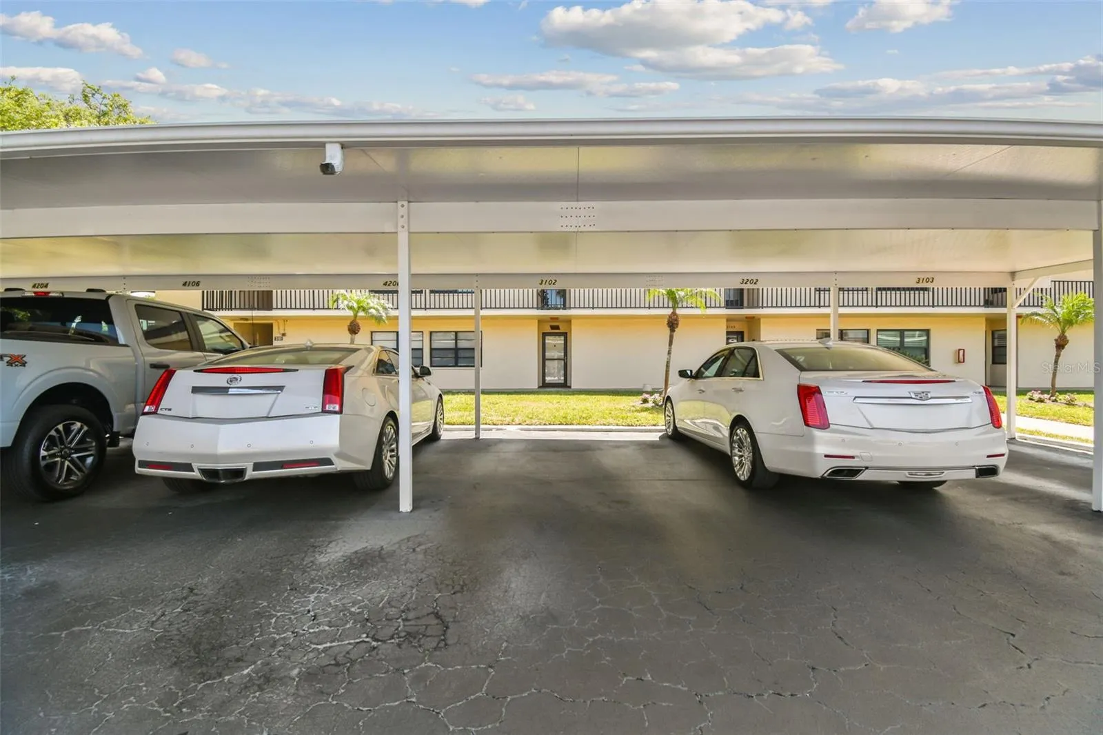 Covered parking directly in front of unit 3102