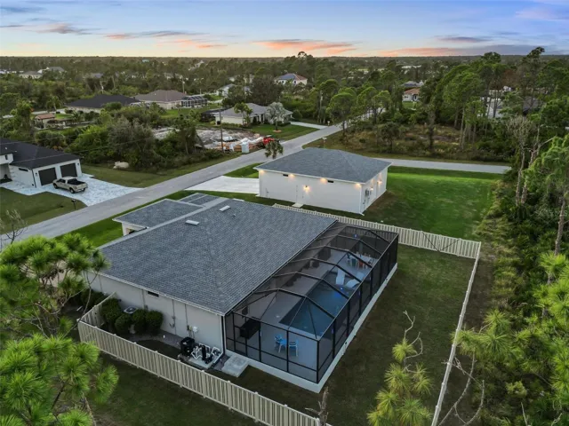 Pool cage is the entire length of the home.