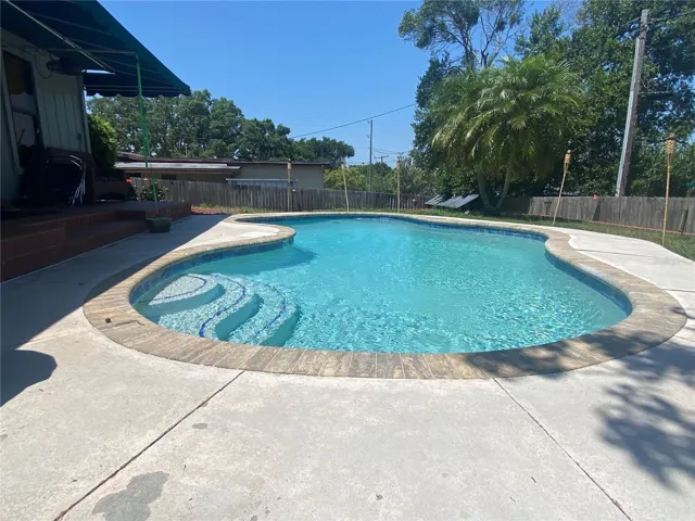 Back yard in-ground swimming pool