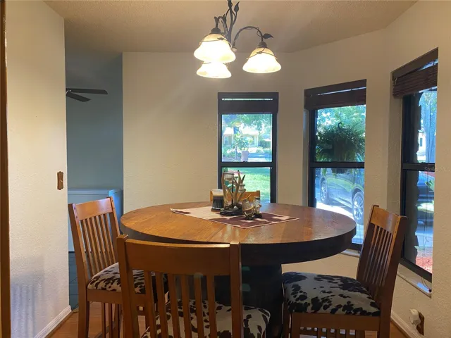 Dinette area has a bay window.