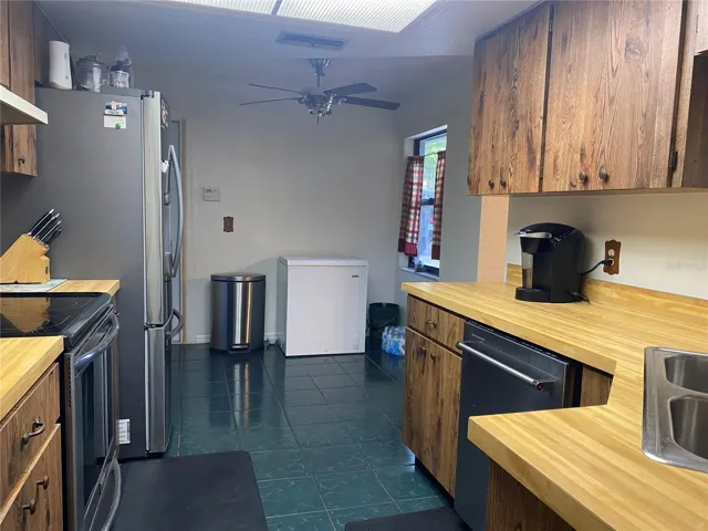 Looking from the dining room into the kitchen