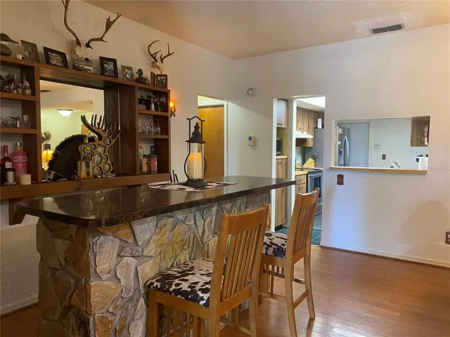 Dining room is right off the kitchen with a pass thru bar.