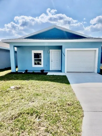 Front of single family home with garage