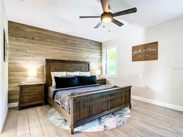 Primary suite with wood feature wall