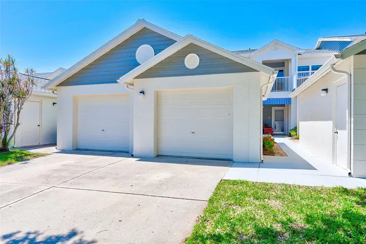 One car detached garage, walkway to entrance