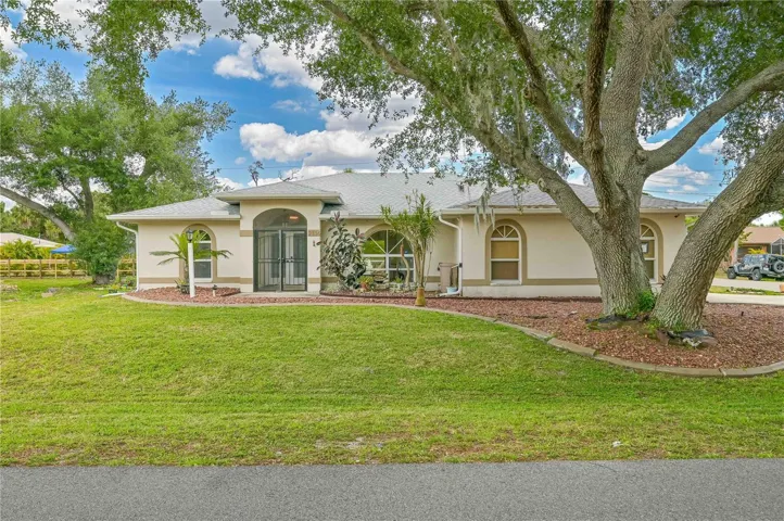Front of home.  Additional lot is located to the left of the home.