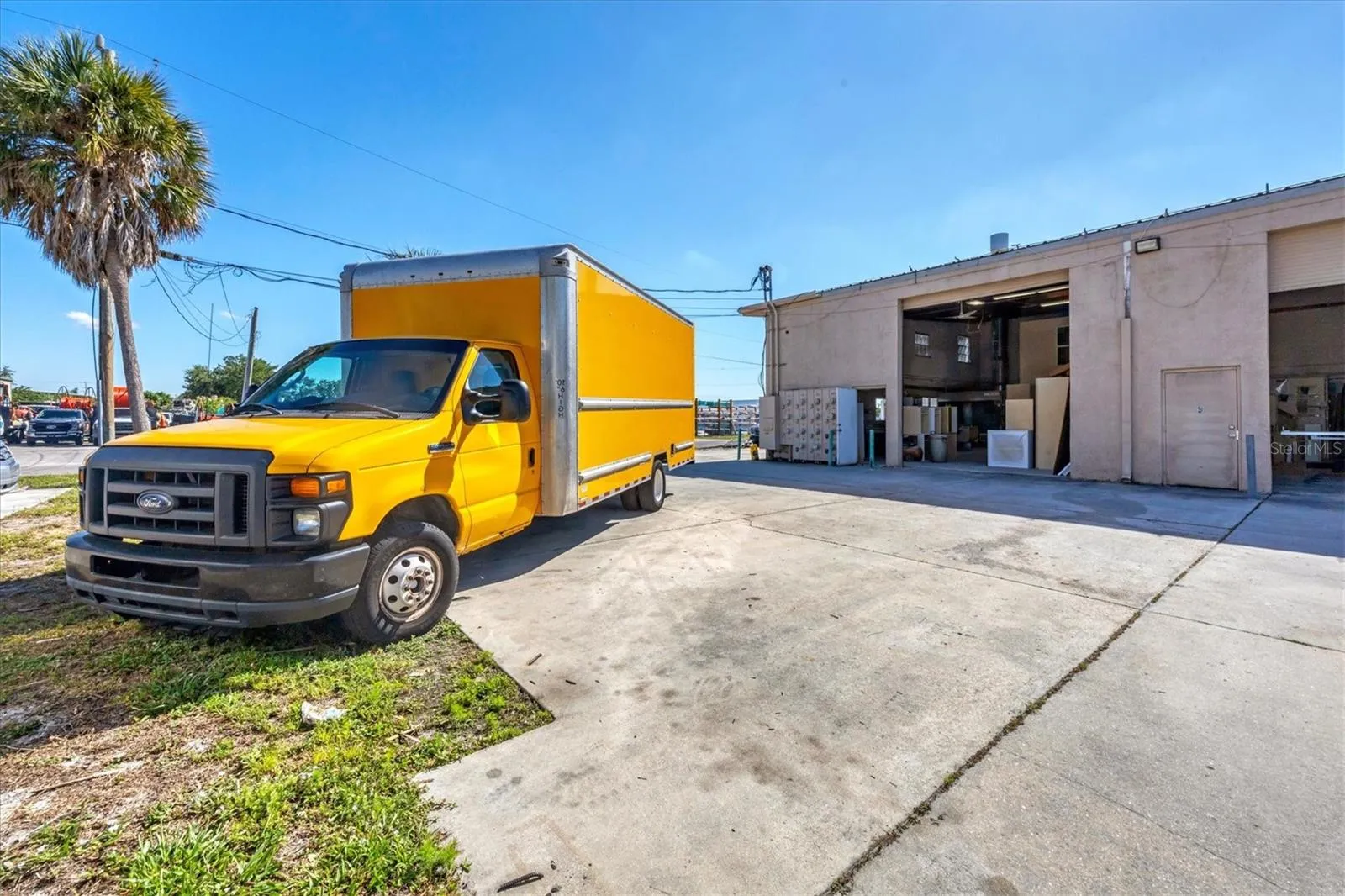 Truck for delivery of cabinets. Building features two over head doors plus second floor air conditioned office space.