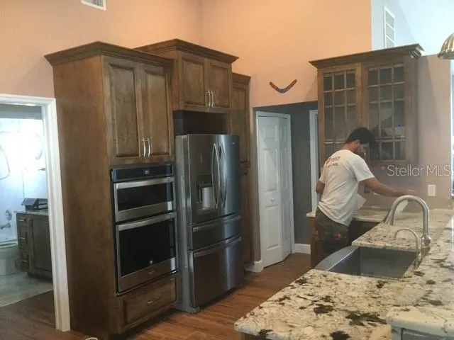 Custom Kitchen in the process of installing cabinet and solid surface counters.