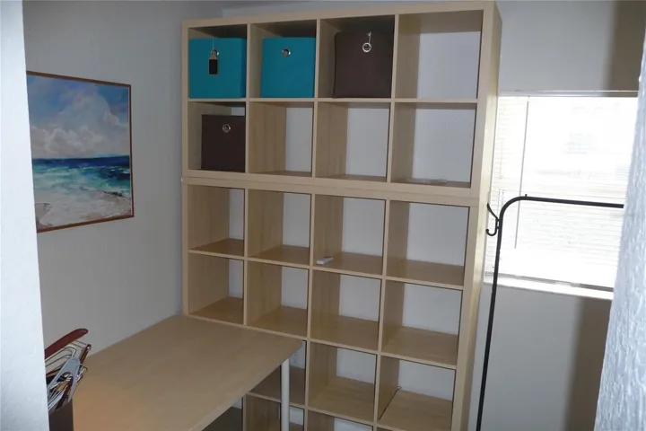 Den area with desk access from foyer or bedroom