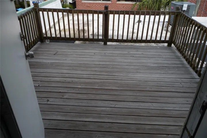 Back deck off apartment. No grills allowed per fire dept.