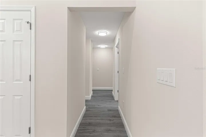 HALLWAY FROM KITCHEN AREA TO 3 BEDROOMS