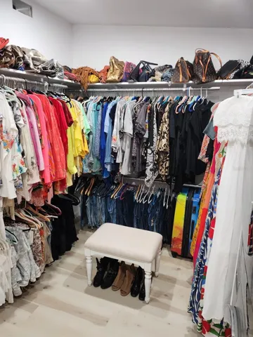 Walk in closet in primary bedroom