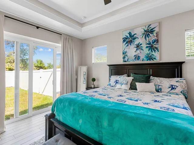 Master Suite with sliders and walk -in Closet