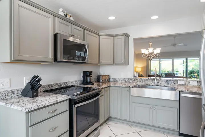 KITCHEN view shows deep, single basin, farmhouse sink w/ PULL DOWN FAUCET