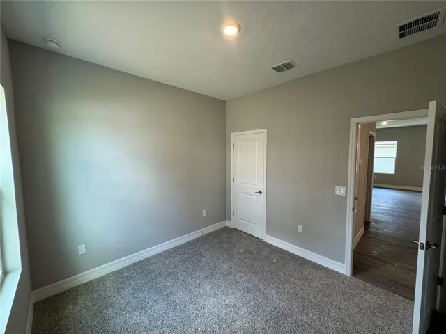 Bedroom 3 with walk in Closet (toward Garage)