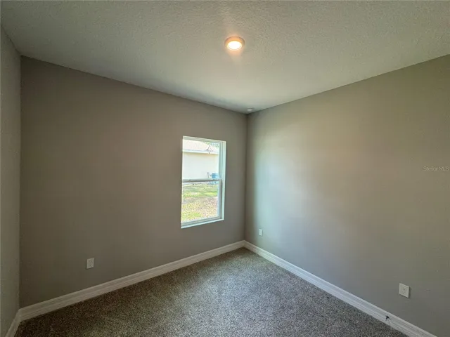 Bedroom 3 with walk in Closet (toward Garage)