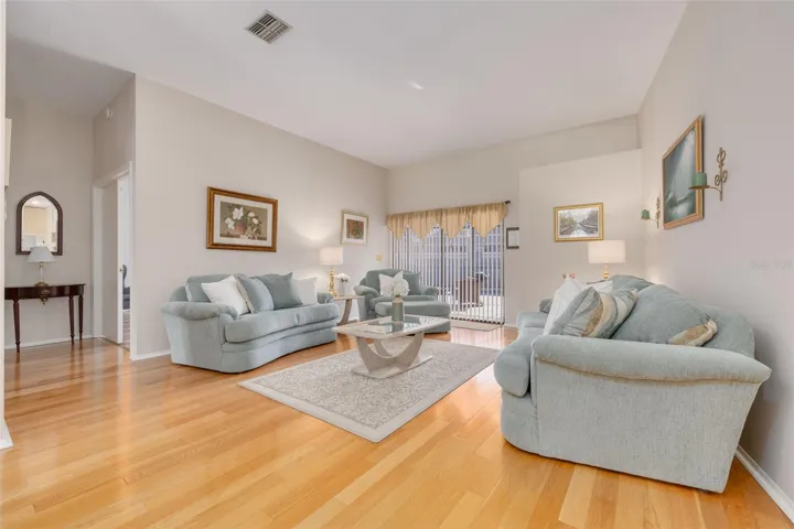 Formal Living Room with Sliders to the Pool area.