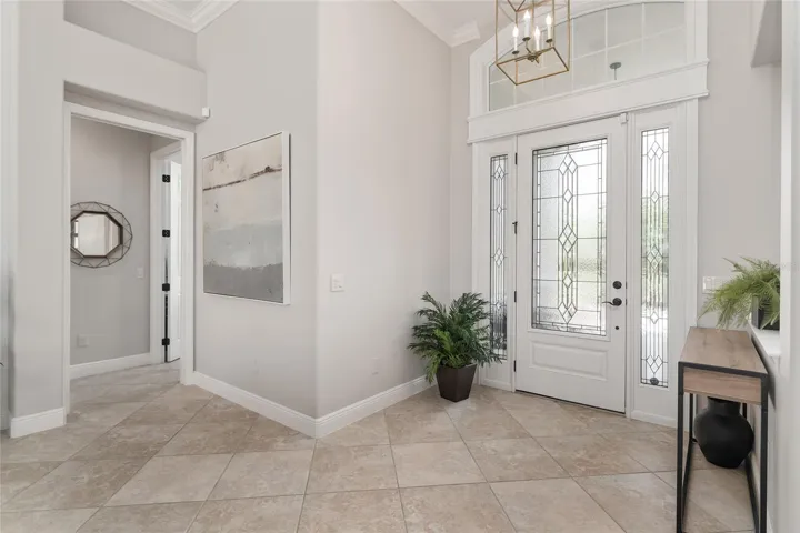 Moving toward the GUEST WING, a HALLWAY (left) is located just off the FOYER.