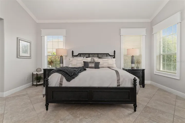 Yet another view of the PRIMARY BEDROOM! Note continuation of CROWN MOLDING, window CORNICES & custom woodworking trim around windows, 5 1/4