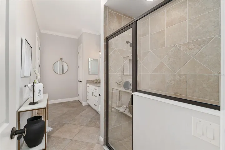 POOL BATH (Bathroom 3) is elongated to accommodate easy access to OUTDOOR LIVING AREA.
