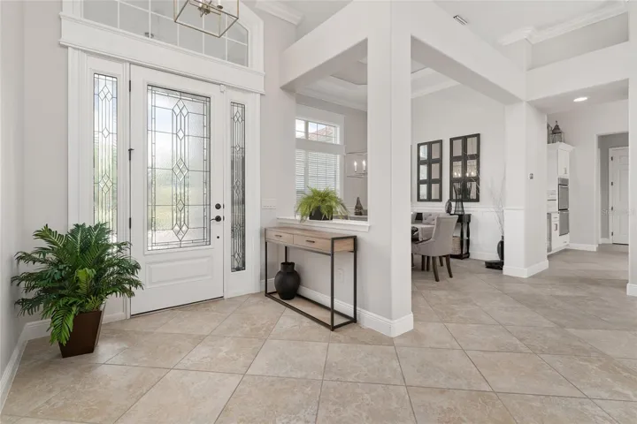 View of FOYER & formal DINING ROOM - Note DIAGONAL SET, CERAMIC TILE FLOORING, 5 1/4