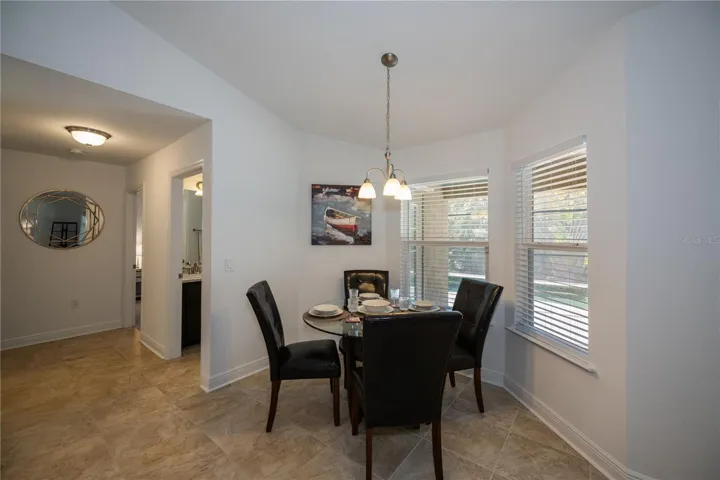 dinette off kitchen has wonderful views of pool