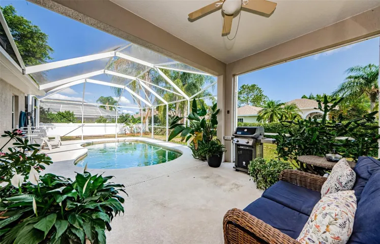Covered area looking to screened pool area